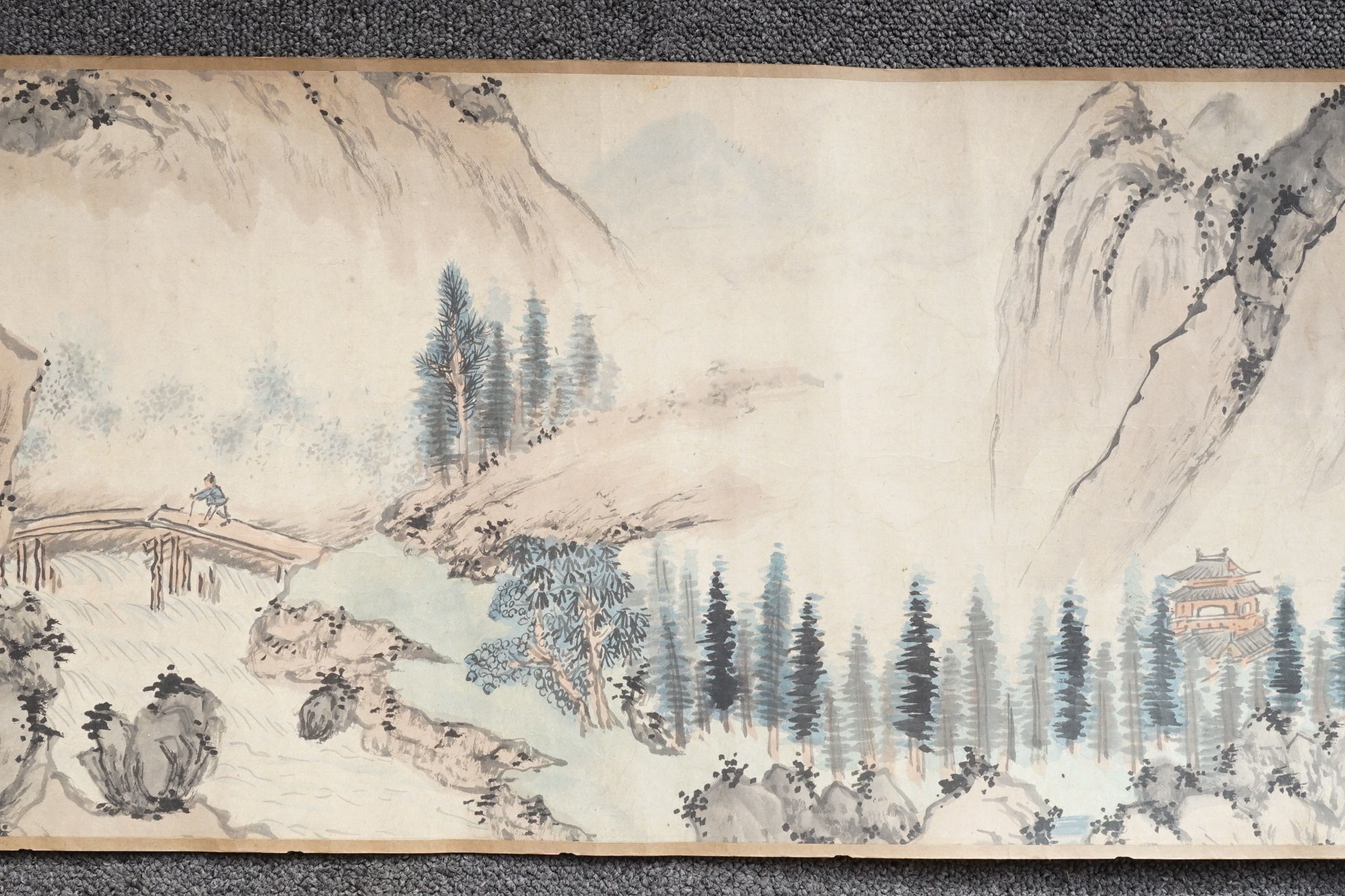 Chinese School , (Qing dynasty), Figures in a mountainous river landscape, Ink and colour on paper handscroll, 268.5cm x 29cm excluding borders
